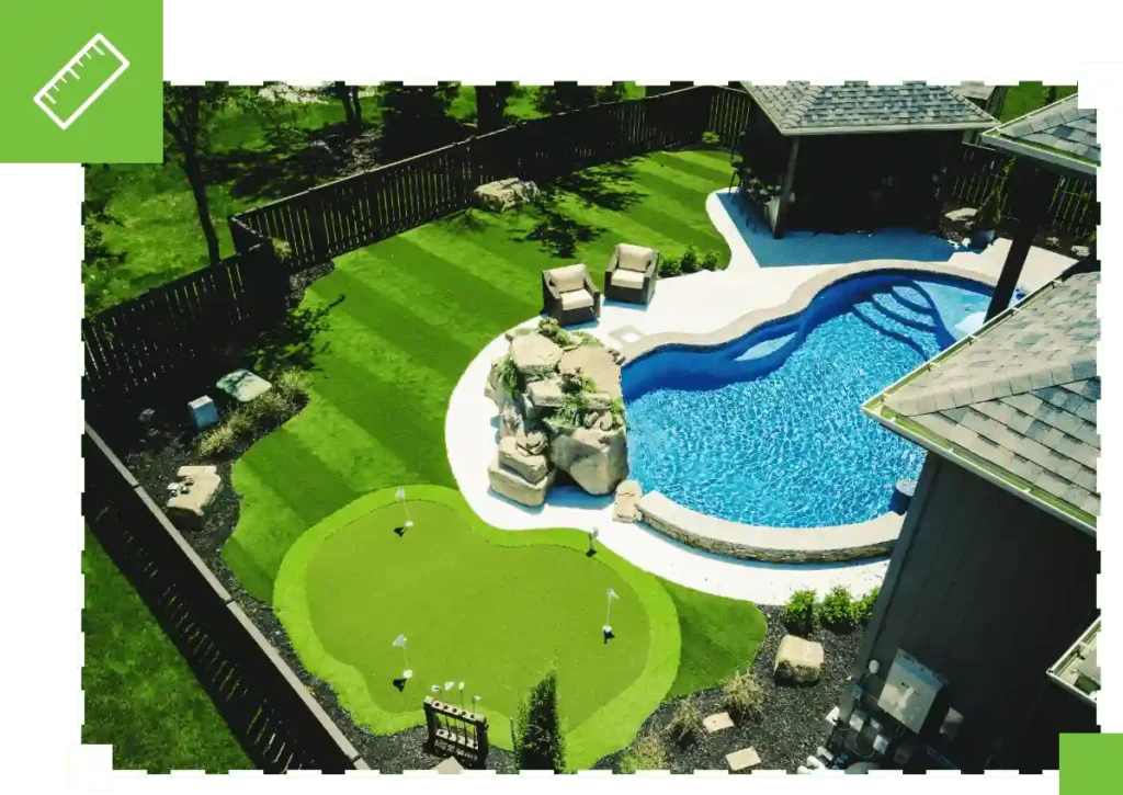 image of synthetic turf backyard with pool and putting green