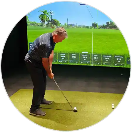 image of golfer training on an indoor golf simulator